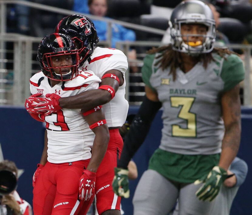 Texas Tech Red Raiders wide receiver Cameron Batson (13) celebrates with a teammate after...