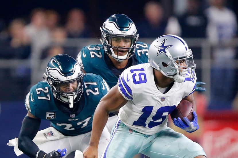 Dallas Cowboys wide receiver Amari Cooper (19) spins away from Philadelphia Eagles strong...