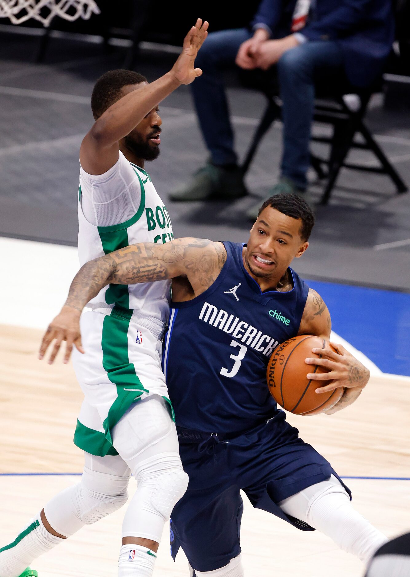 Dallas Mavericks guard Trey Burke (3) trees to get around Boston Celtics guard Kemba Walker...