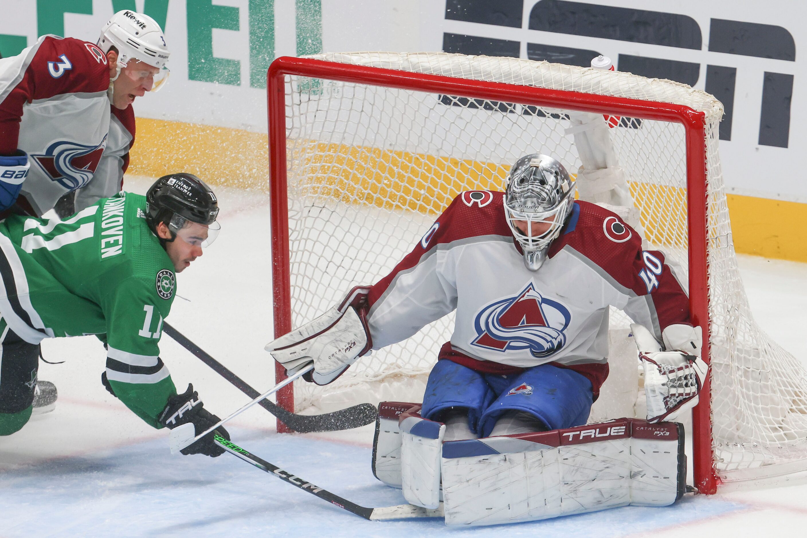 Colorado Avalanche defenseman Jack Johnson (3) collides with Dallas Stars center Logan...