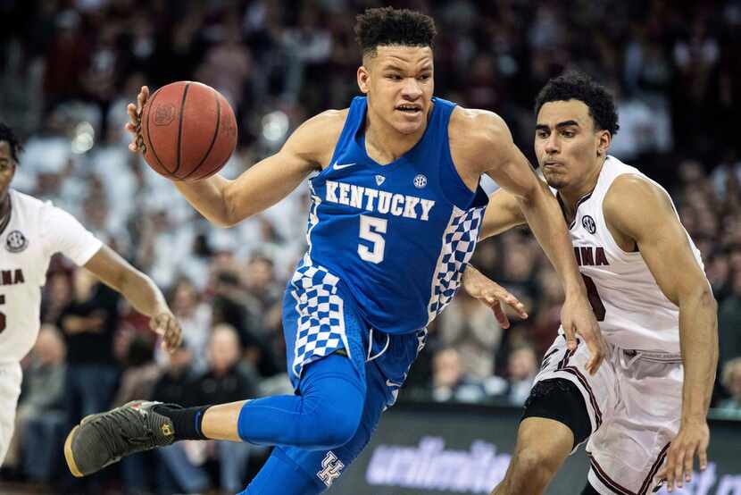 FILE - In this Jan. 16, 2018, file photo, Kentucky forward Kevin Knox (5) dribbles the ball...