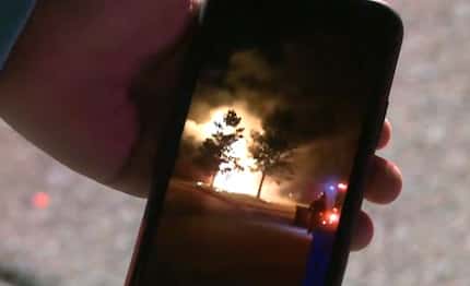 A neighbor shares cellphone video of a fire that broke out Monday night in Mansfield.