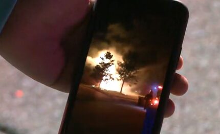 A neighbor shares cellphone video of a fire that broke out Monday night in Mansfield.