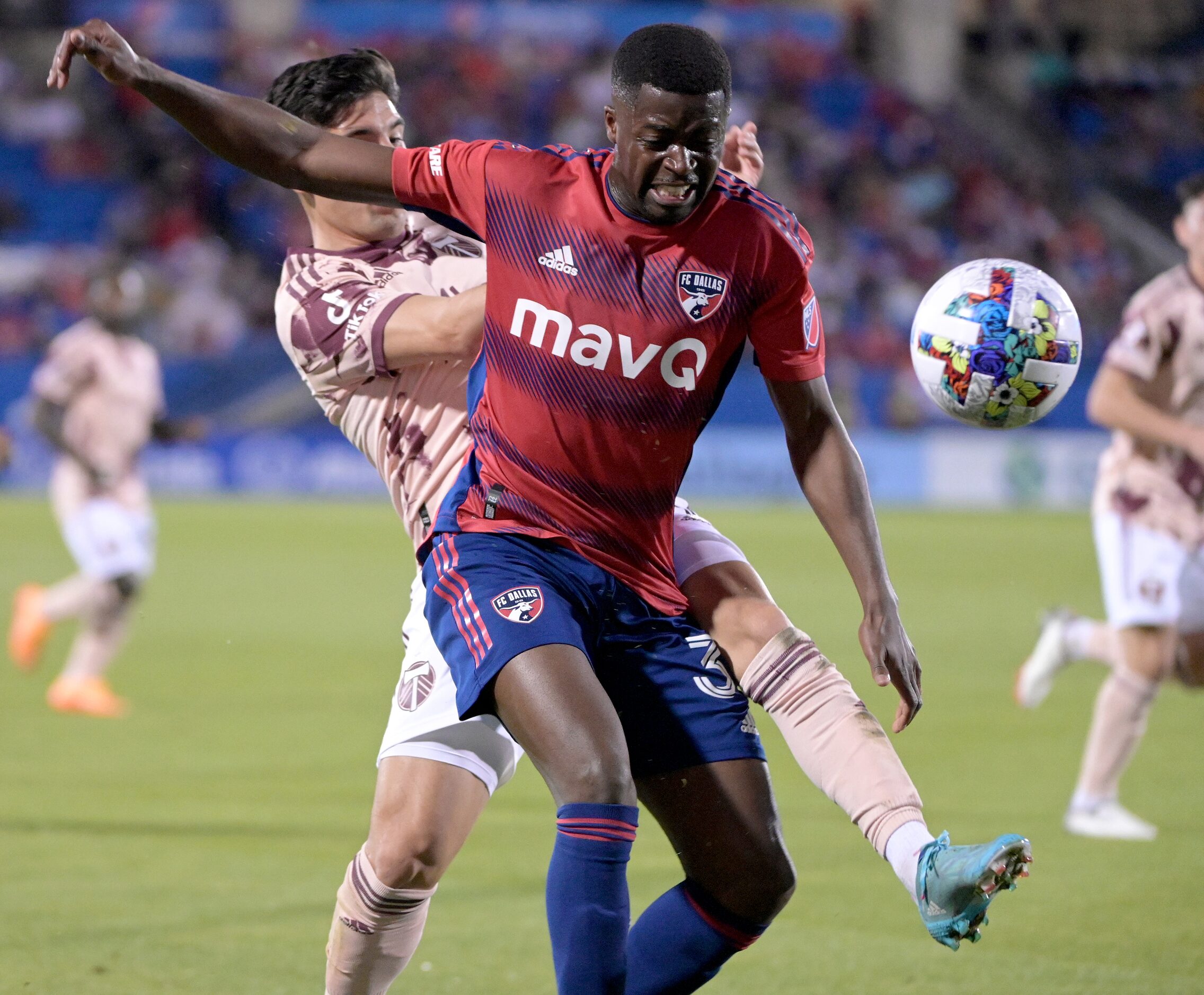 FC Dallas defender Nanú (31) goes after a ball with Portland Timbers defender Claudio Bravo...