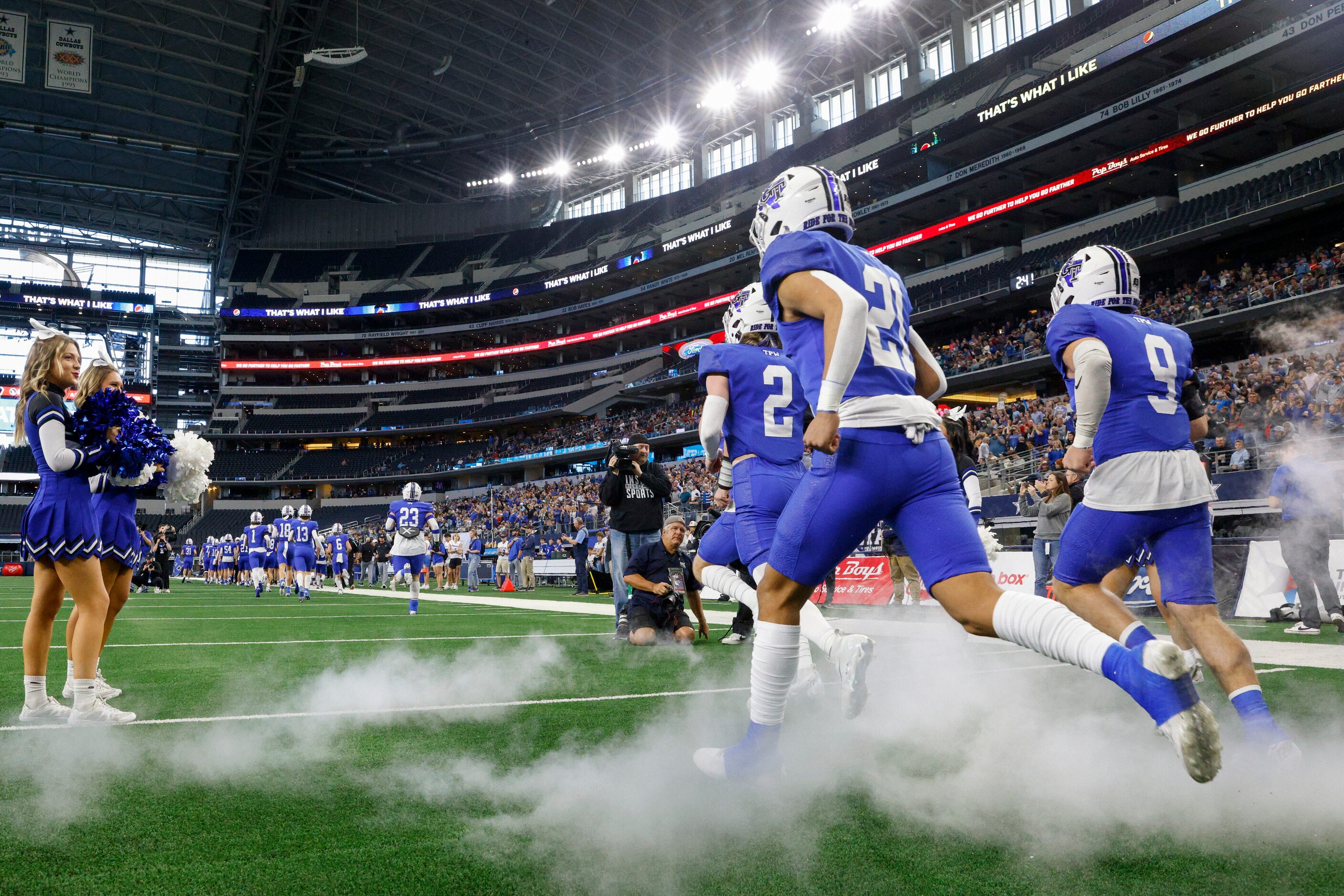 Gunter players take the field before the Class 3A Division II state championship game...