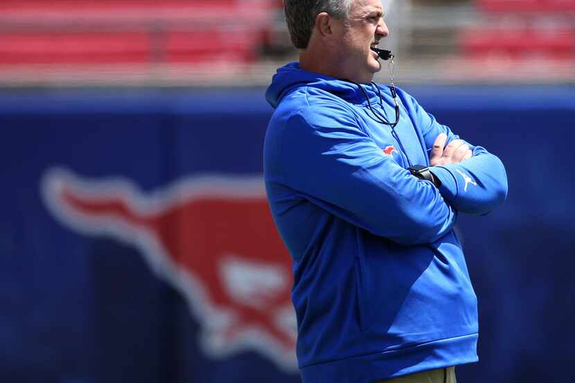 Southern Methodist Mustangs head coach Sonny Dykes watches a play during Southern Methodist...