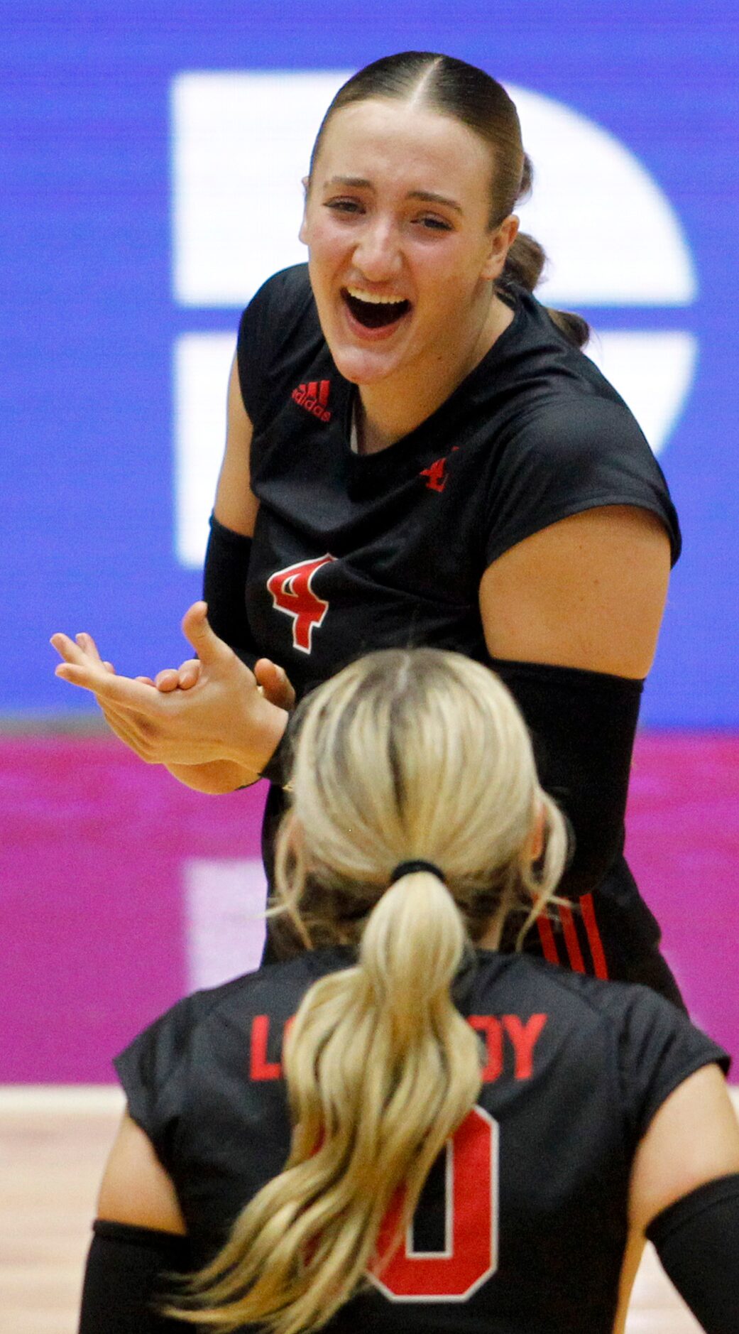 Lucas Lovejoy junior Anna Barr (4), top, applauds the score of teammate Skylar Jackson (10)...