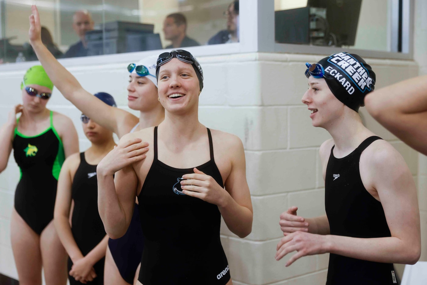 Panther Creek high’s Eden L Addison (center) and Cuba F Eckard (right) react while preparing...