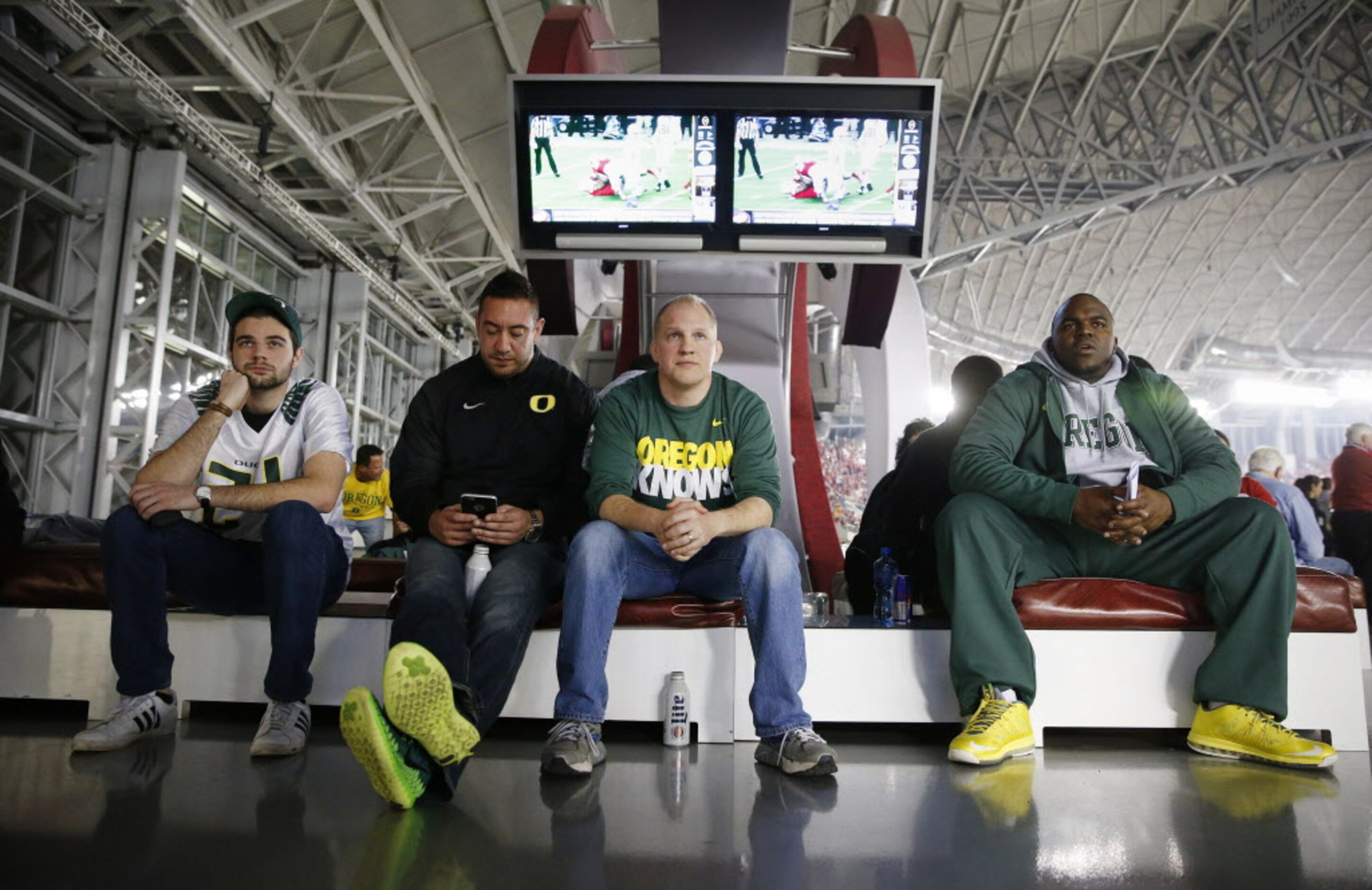 (From left) Oregon Ducks fans Jackson Long, of Dallas, Scott Koski, David Perkins, both of...