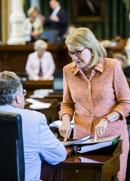 Sen. Sylvia Garcia, D-Houston, talks with Sen. Craig Estes, R-Wichita Falls, after the...