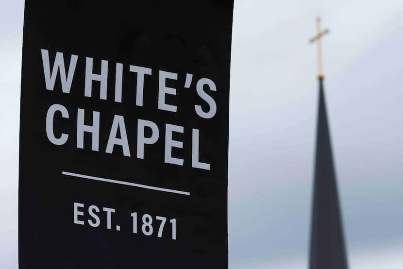 The steeple of White's Chapel United Methodist seen by a sign on Thursday, Dec. 1, 2022 in...