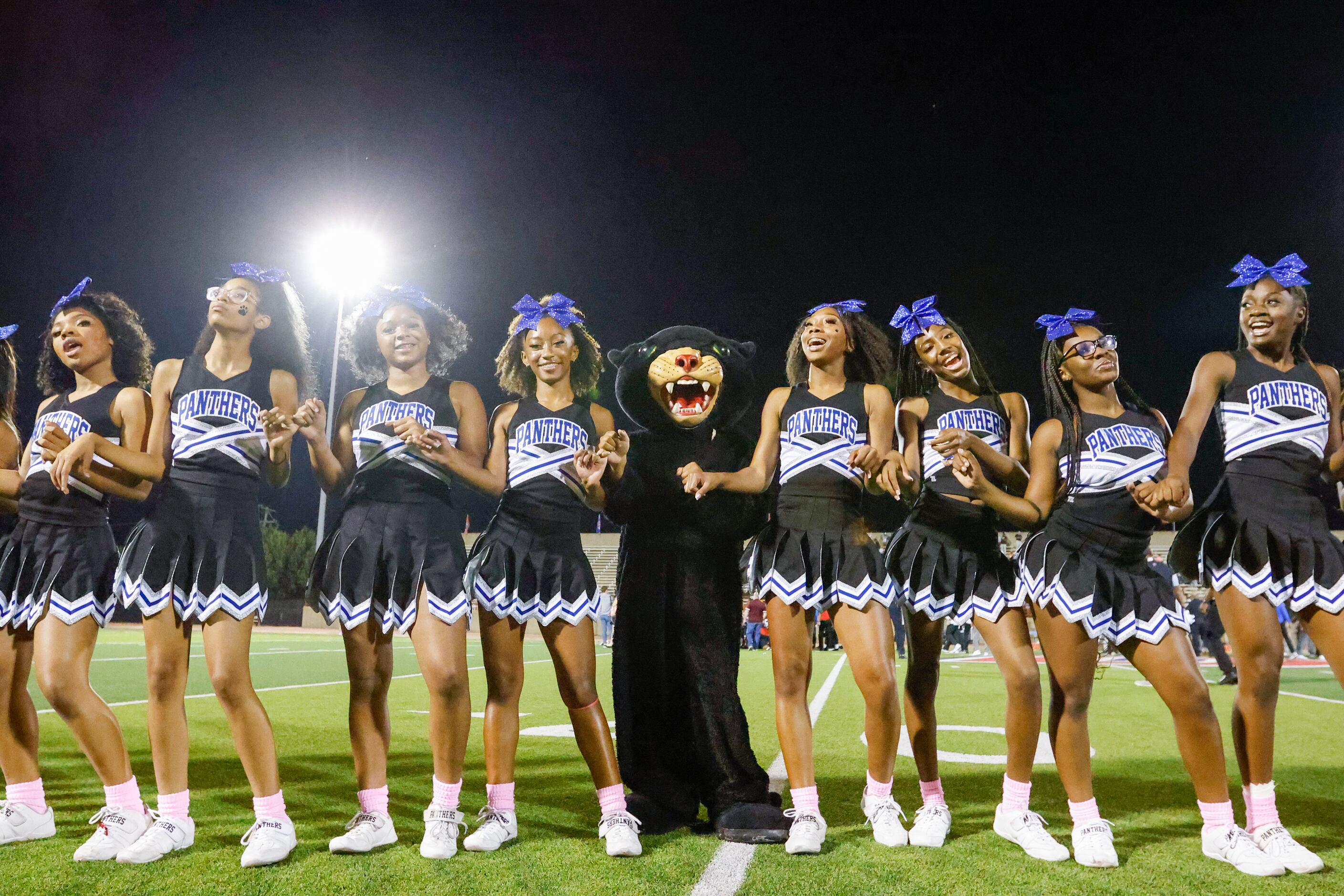 Duncanville cheerleaders celebrate the team’s win against Waxahachie at Panther Stadium in...