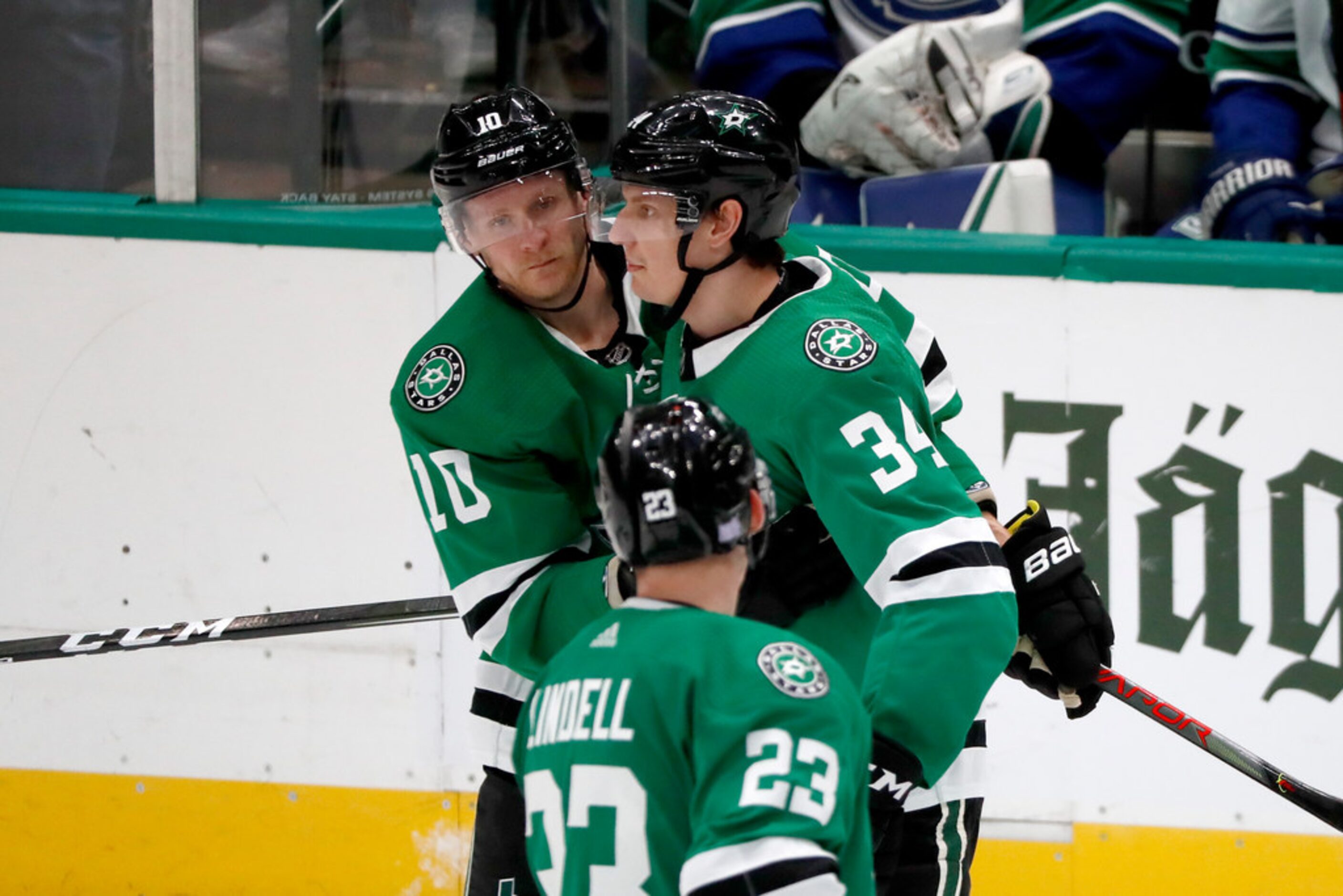 Dallas Stars defenseman Esa Lindell (23), Corey Perry (10) and Denis Gurianov (34) celebrate...