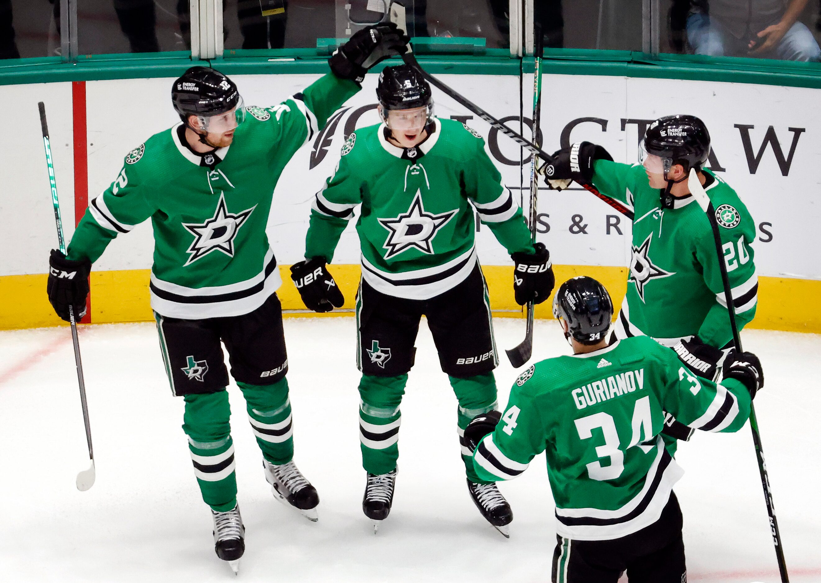 Dallas Stars defenseman Nils Lundkvist (5, center) is congratulated on his first period goal...