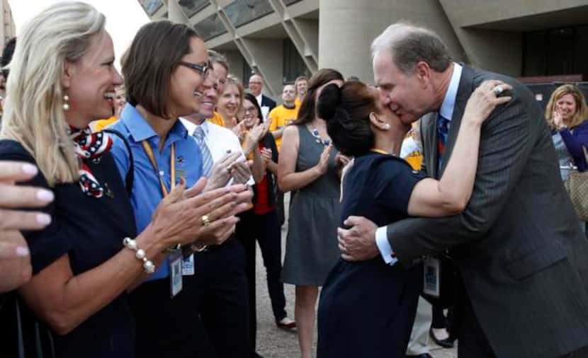 
Southwest Airlines CEO and Chairman Gary Kelly gives a hug to SWA flight attendant Perla...
