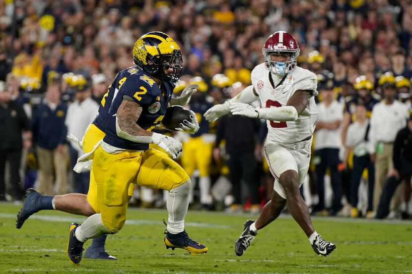 Michigan running back Blake Corum (2) runs for a touchdown during overtime in the Rose Bowl...