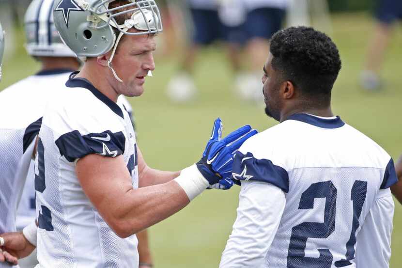 Dallas Cowboys tight end Jason Witten (left) talks with Ezekiel Elliott (21) during a...