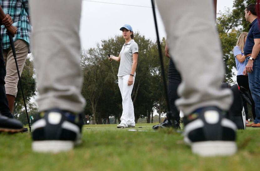 Alyssa Richardson, with North Texas PGA, teaches students about putting during Fairway to...
