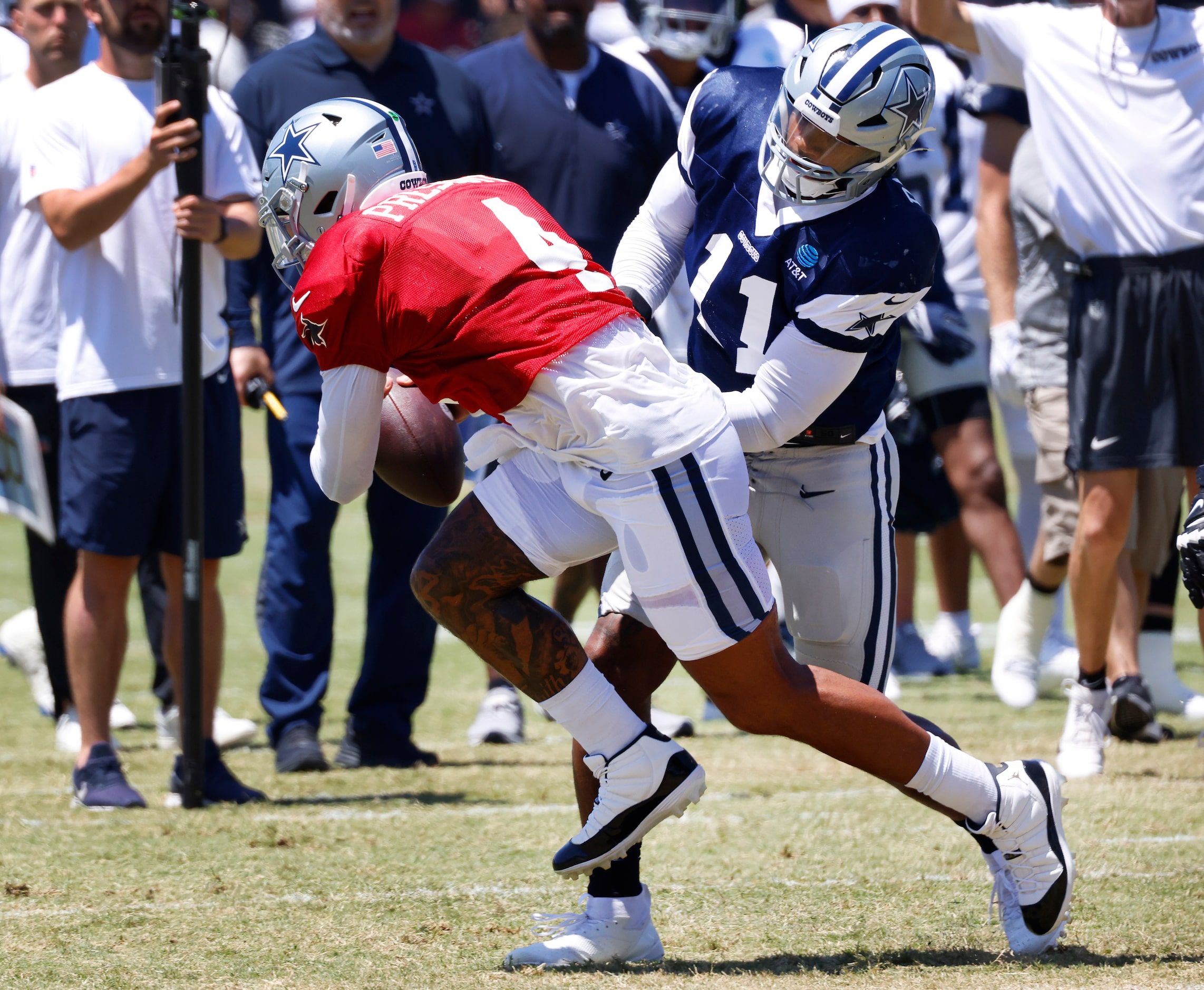 Dallas Cowboys linebacker Micah Parsons (11) gets a sack of quarterback Dak Prescott (4)...