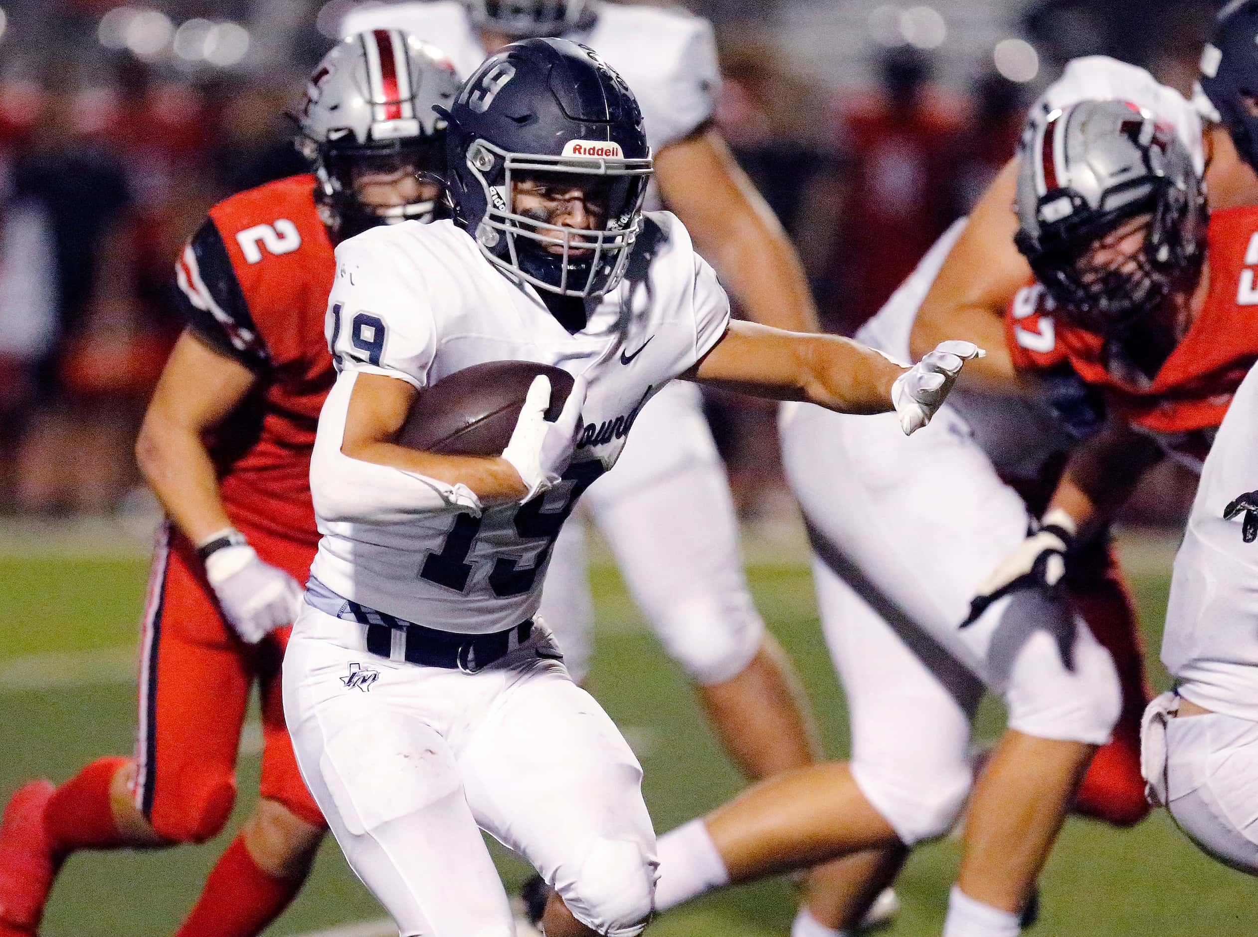 Flower Mound High School running back Cade Edlein (19) runs for a big gain during the first...