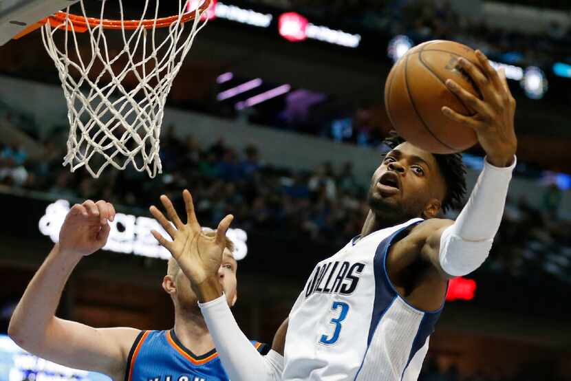 Dallas Mavericks forward Nerlens Noel (3) grabs a rebound in front of Oklahoma City Thunder...