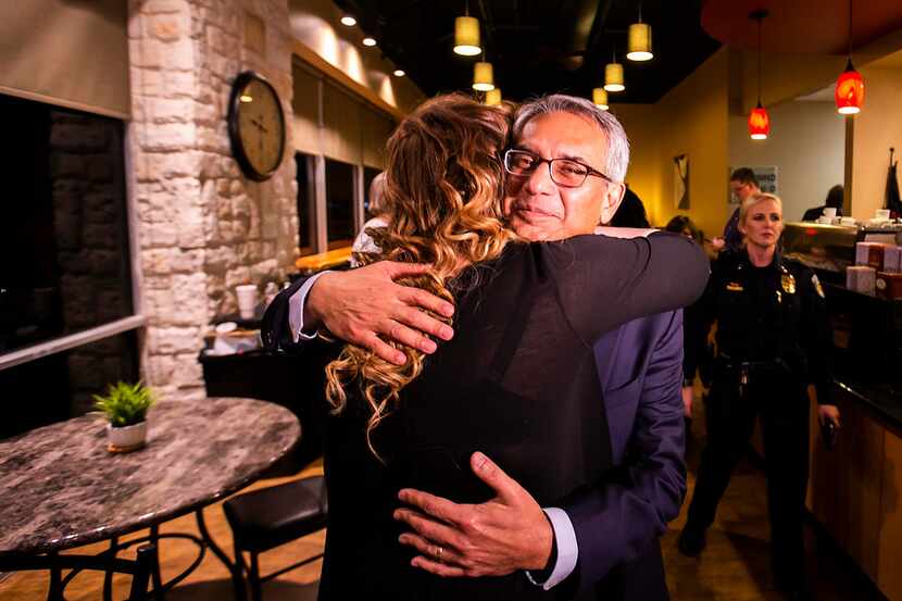 Tarrant County Republican Party  vice chair Dr. Shahid Shafi hugs a supporter after the...