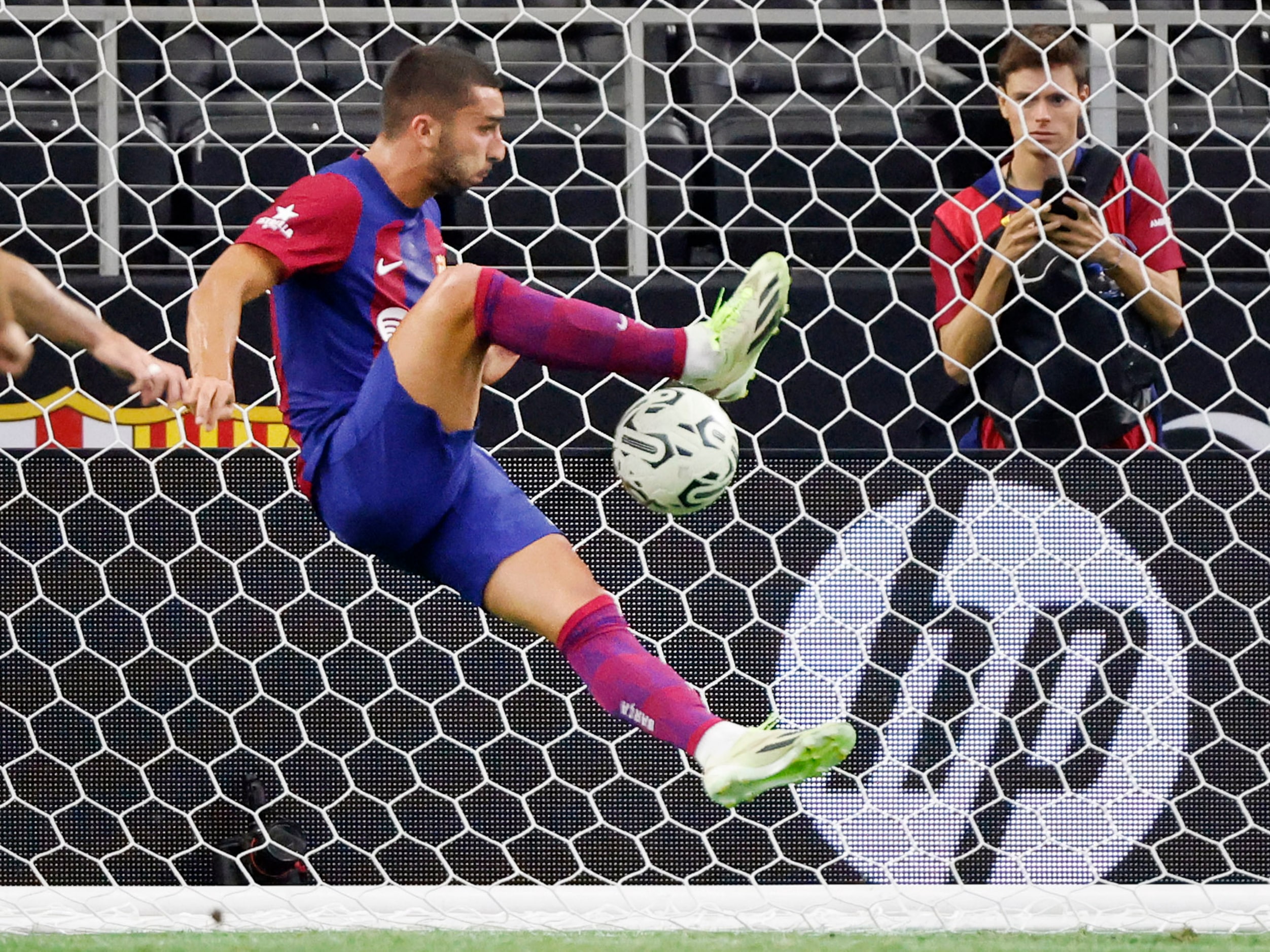 Barcelona forward Ferrán Torres (11) scores on an empty net during the second half of their...