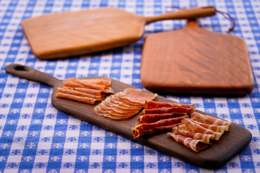 Hand-carved wooden boards made by chef David Uygur at at Macellaio in Bishop Arts 