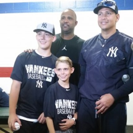  Tracen and brother Blake take a photo with Yankees stars C.C. Sabathia and Alex Rodriguez....