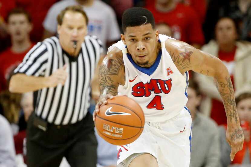 SMU guard Keith Frazier (4) travels up the court in the first half during an NCAA basketball...
