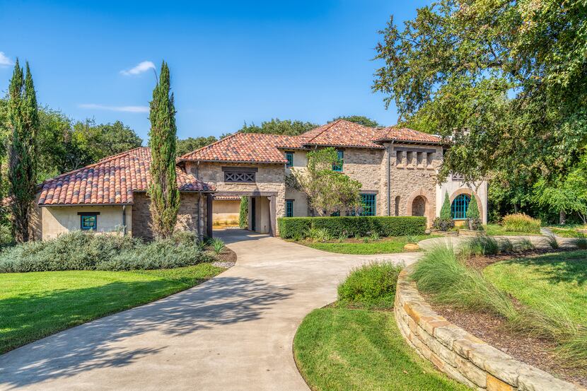 The custom-built Tuscan-style home at 3521 Chimney Rock Drive in Flower Mound has five...