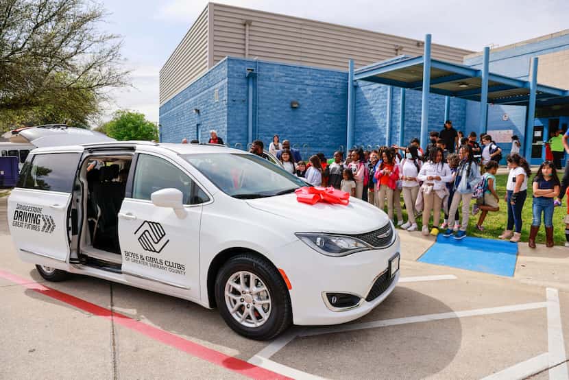 Children check out a new passenger van at the Boys & Girls Clubs of Tarrant County Martin...