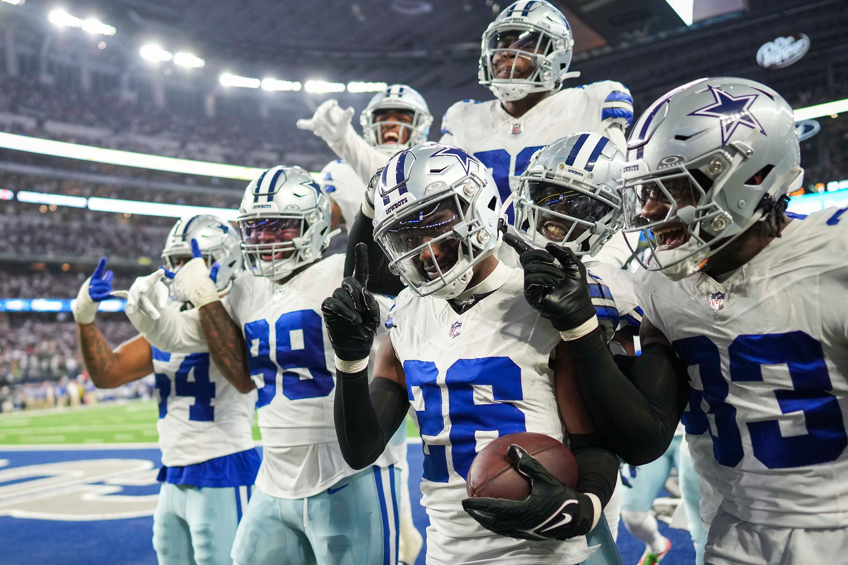 Dallas Cowboys cornerback DaRon Bland (26) celebrates with teammates after intercepting a...