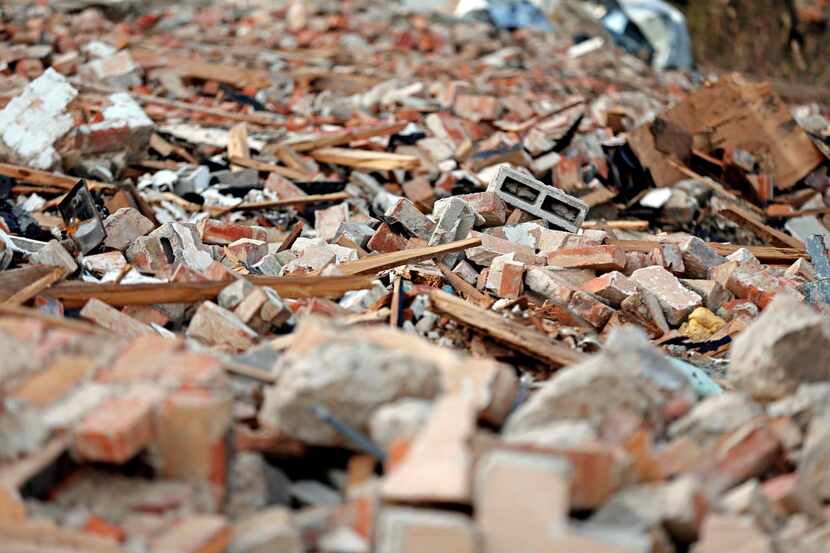 
Demolition debris is piled high at the Mission Motel. 
