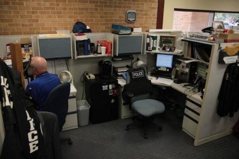 
Bryan Turner works in an area designated for detectives at the Carrollton Police...