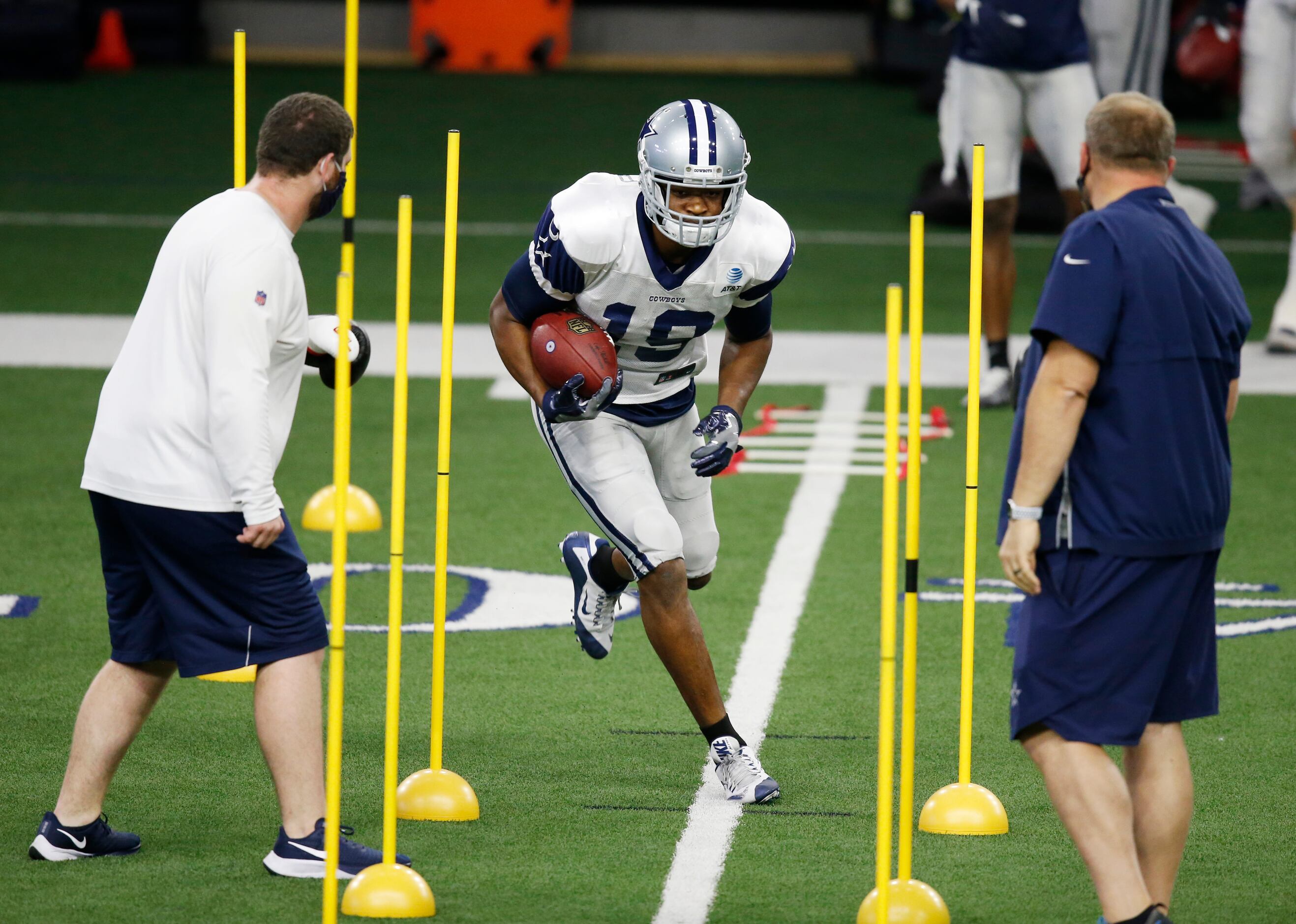 Dallas Cowboys wide receiver Amari Cooper (19) runs through a drill in practice during...