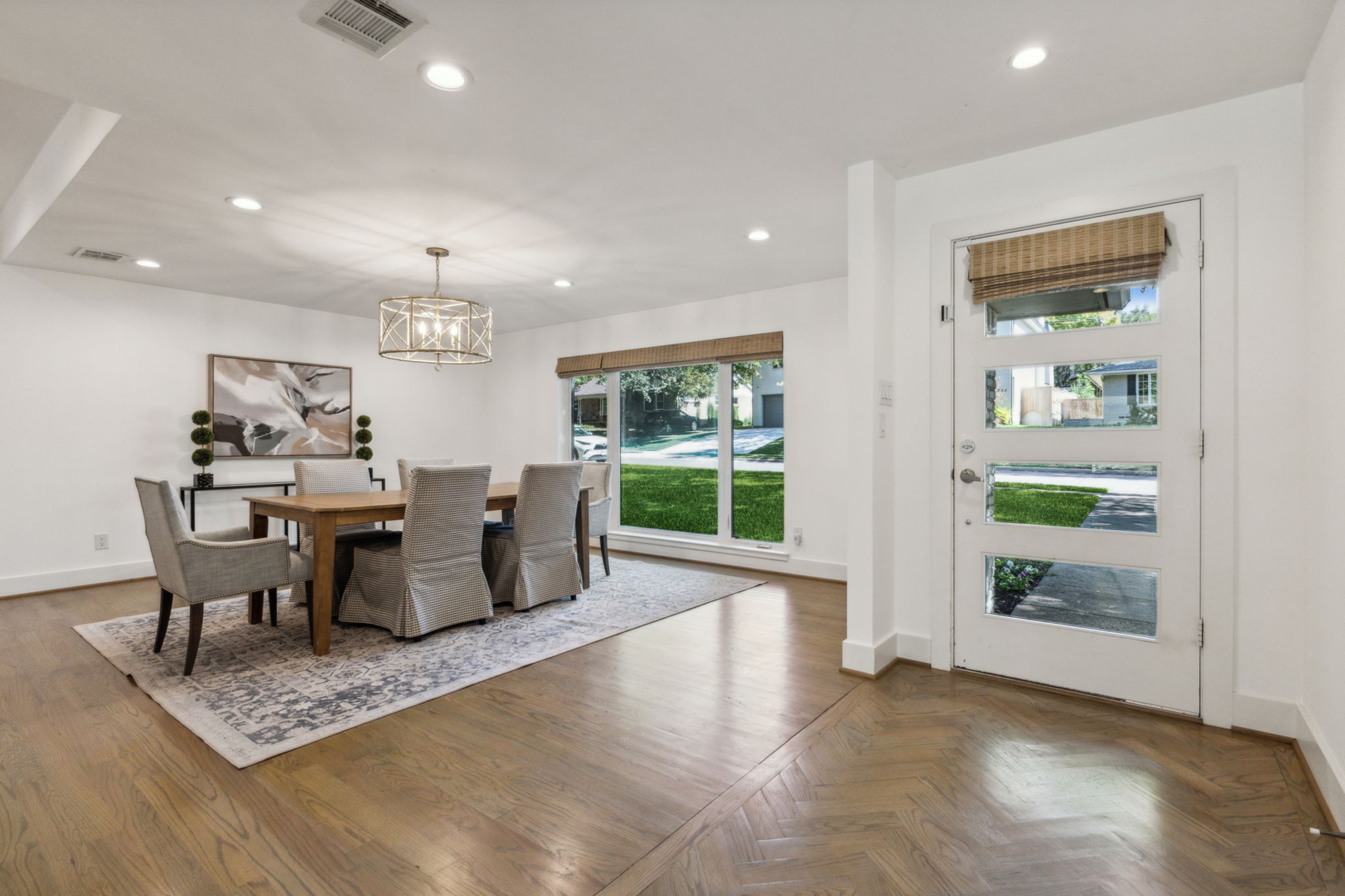 At the front of the home, the dining room looks out to the neighborhood.