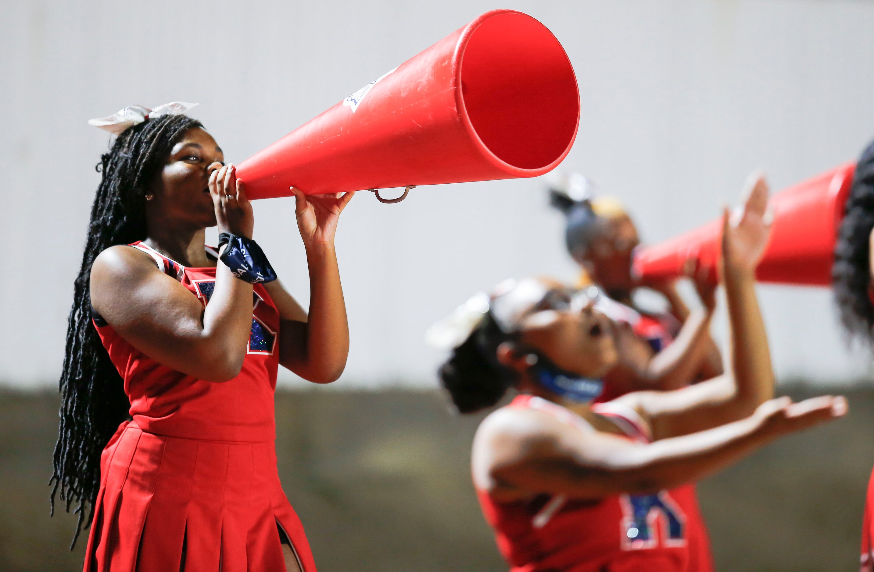 Kimball cheerleaders cheer on their team during the first half of a high school football...