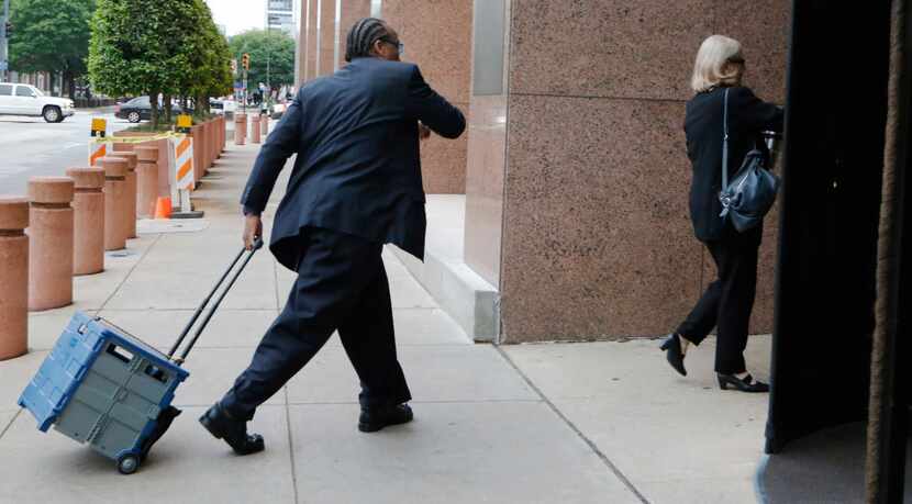 John Wiley Price and his lawyer, Shirley Baccus-Lobel, entered the federal courthouse in...