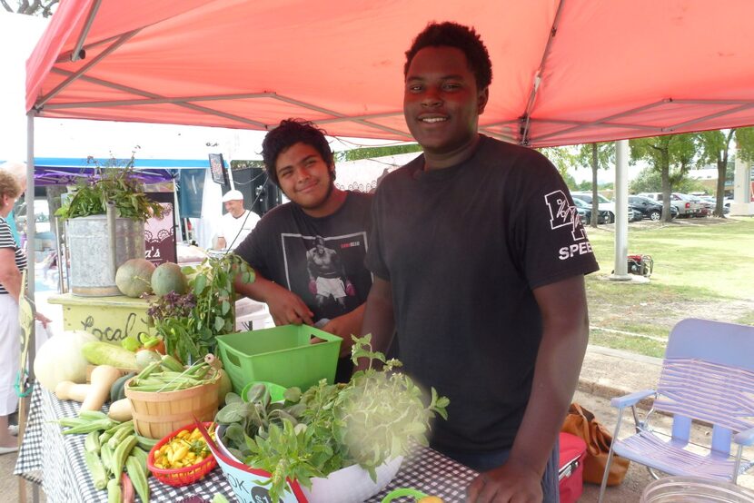 Promise of Peace Community Garden interns Noel Jones and Guillermo Martinez do a little bit...