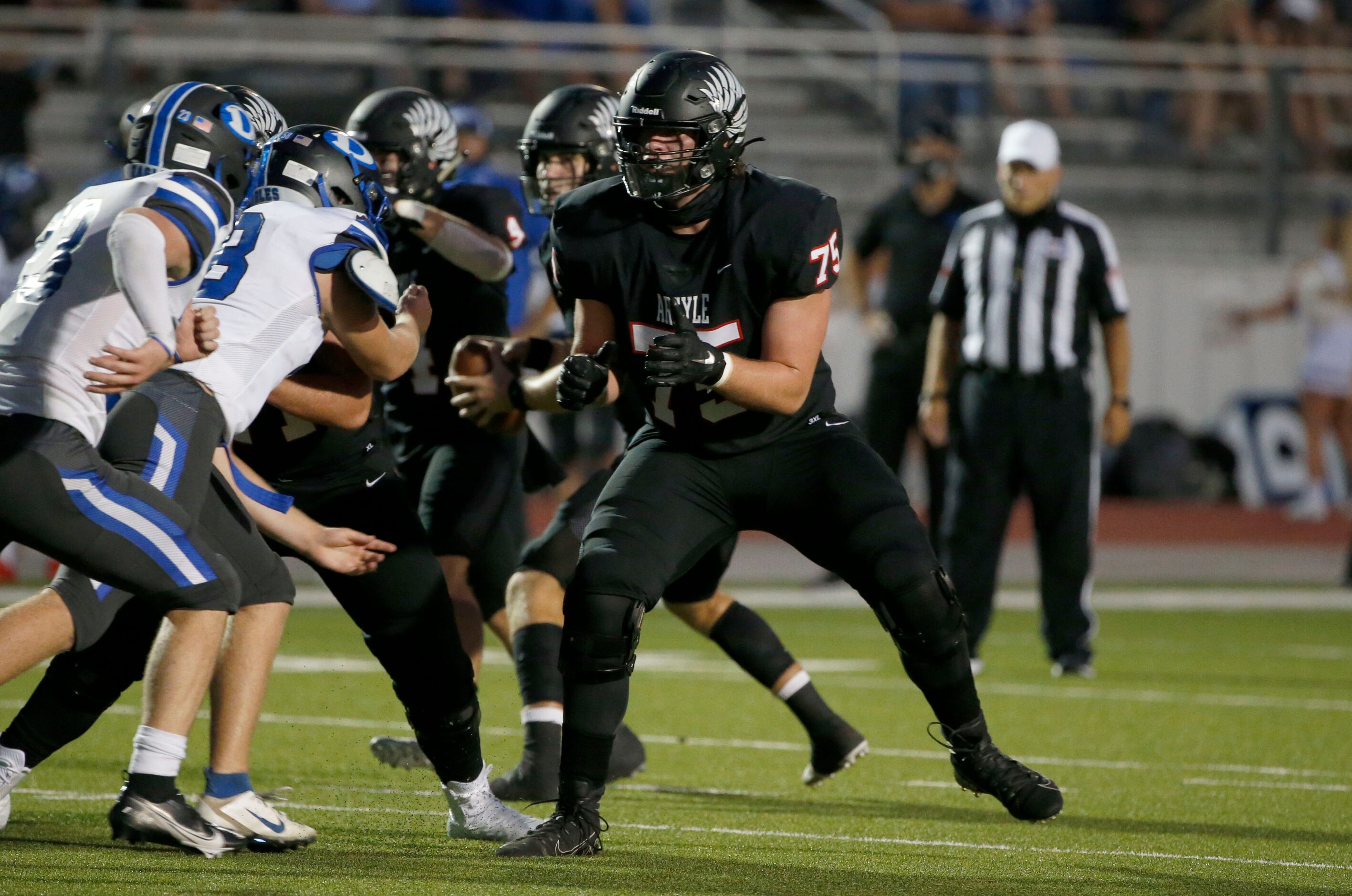 Argyle offensive lineman Jack Tucker (75) plays against Decatur during a high school...