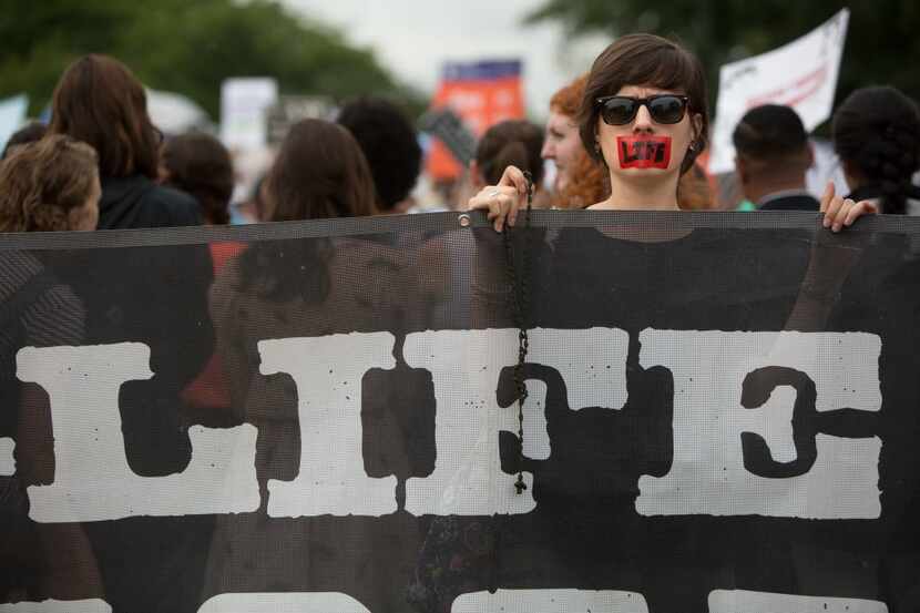 An abortion opponent protests in front of the U.S. Supreme Court. (Allison Shelley/Getty...