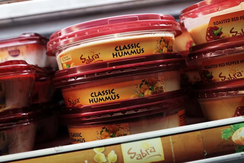Cases of Sabra Classic Hummus are viewed on the shelf of a grocery store on April 9, 2015 in...