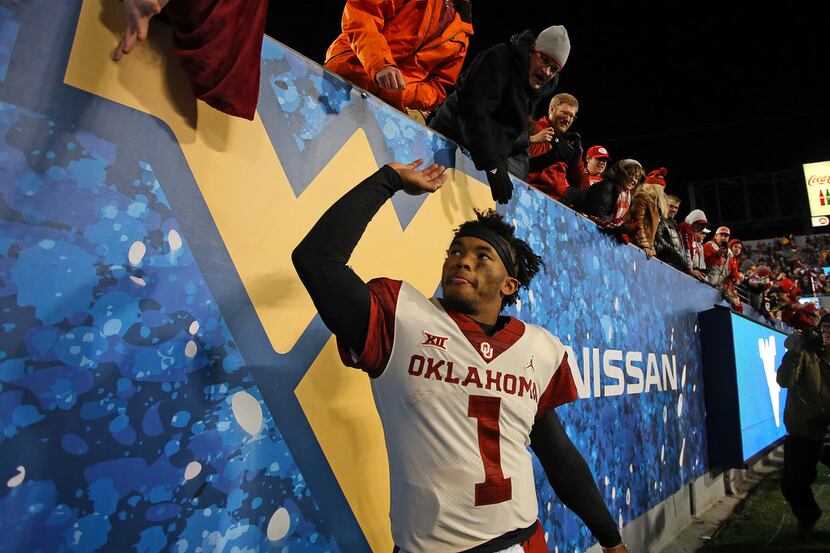 MORGANTOWN, WV - NOVEMBER 23:  Kyler Murray #1 of the Oklahoma Sooners celebrates after...