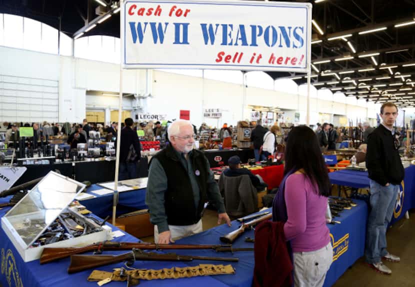 Dudley Brown talks with an attendee at the Dallas Gun and Knife Show at Dallas Market Hall...