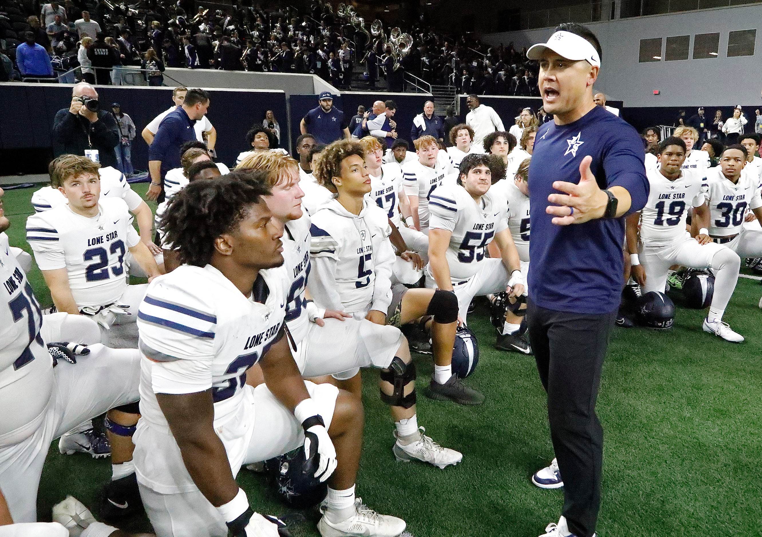 Lone Star High School head coach Jeff Rayburn talks to his team after the win as Reedy High...