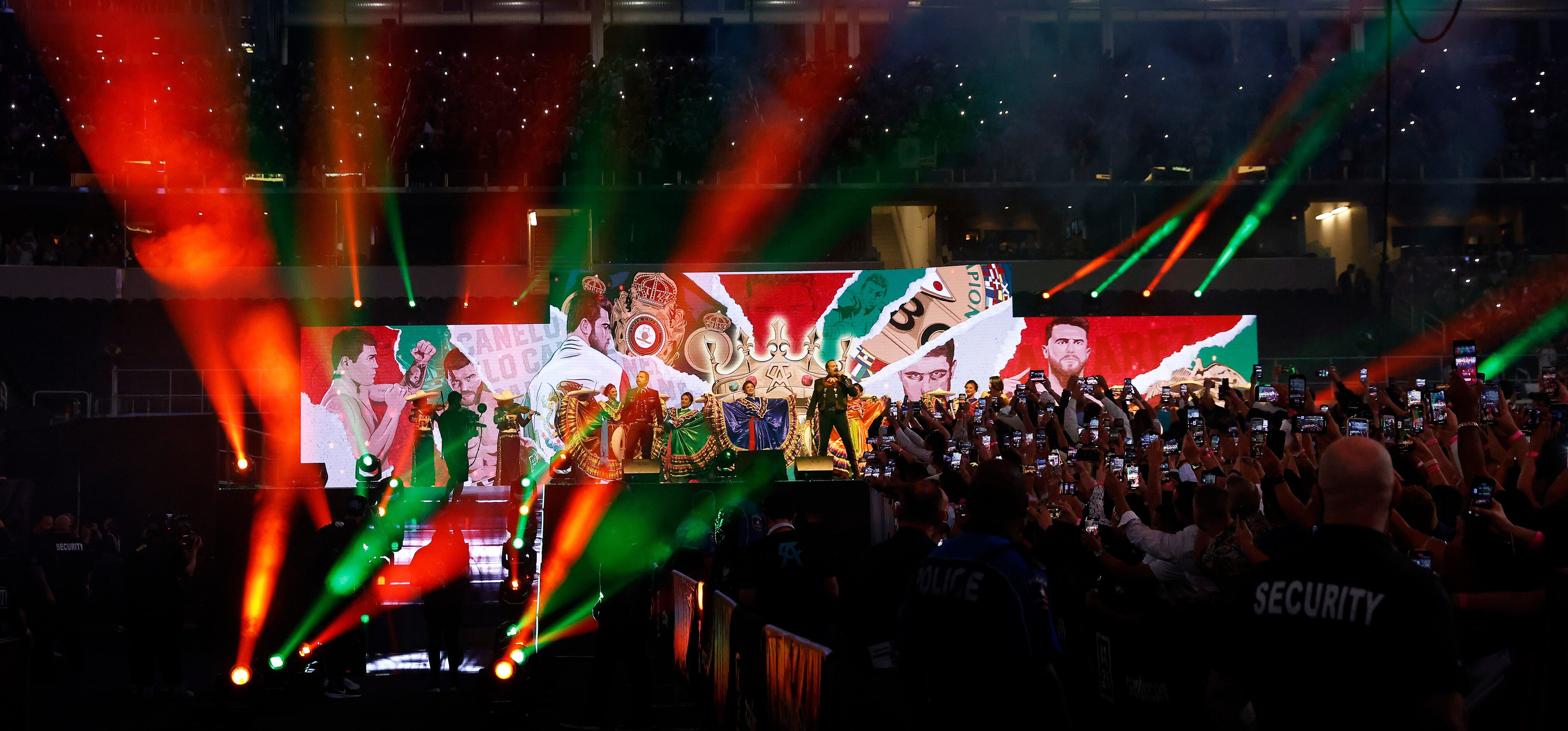 Singers and dancers greeted Mexican boxer Canelo Alvarez before he's introduced for the...