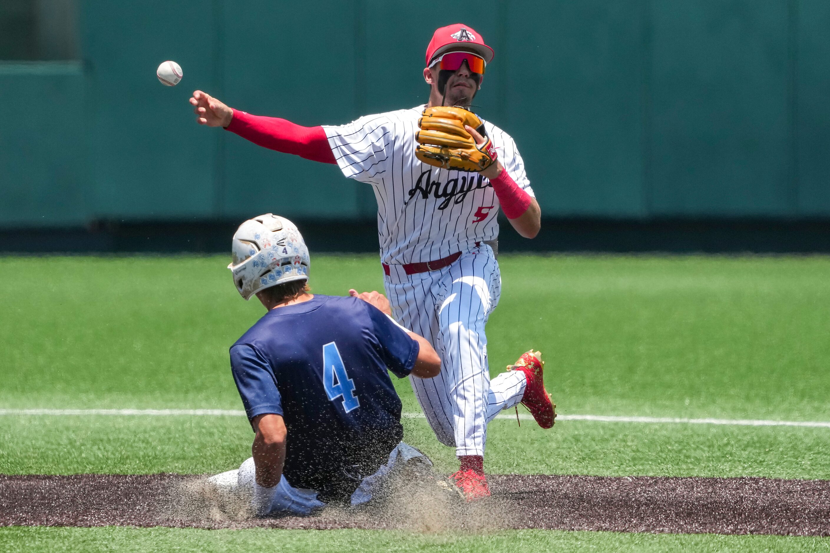 Argyle second baseman Colton Roquemore (5) makes the relay on a double play over China...