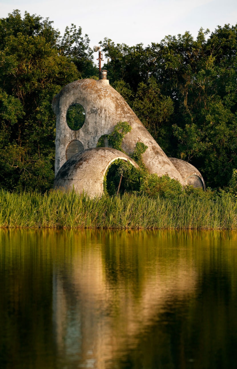 The white surface of Ant Farm's House of the Century in Angleton has peeled off, leaving a...