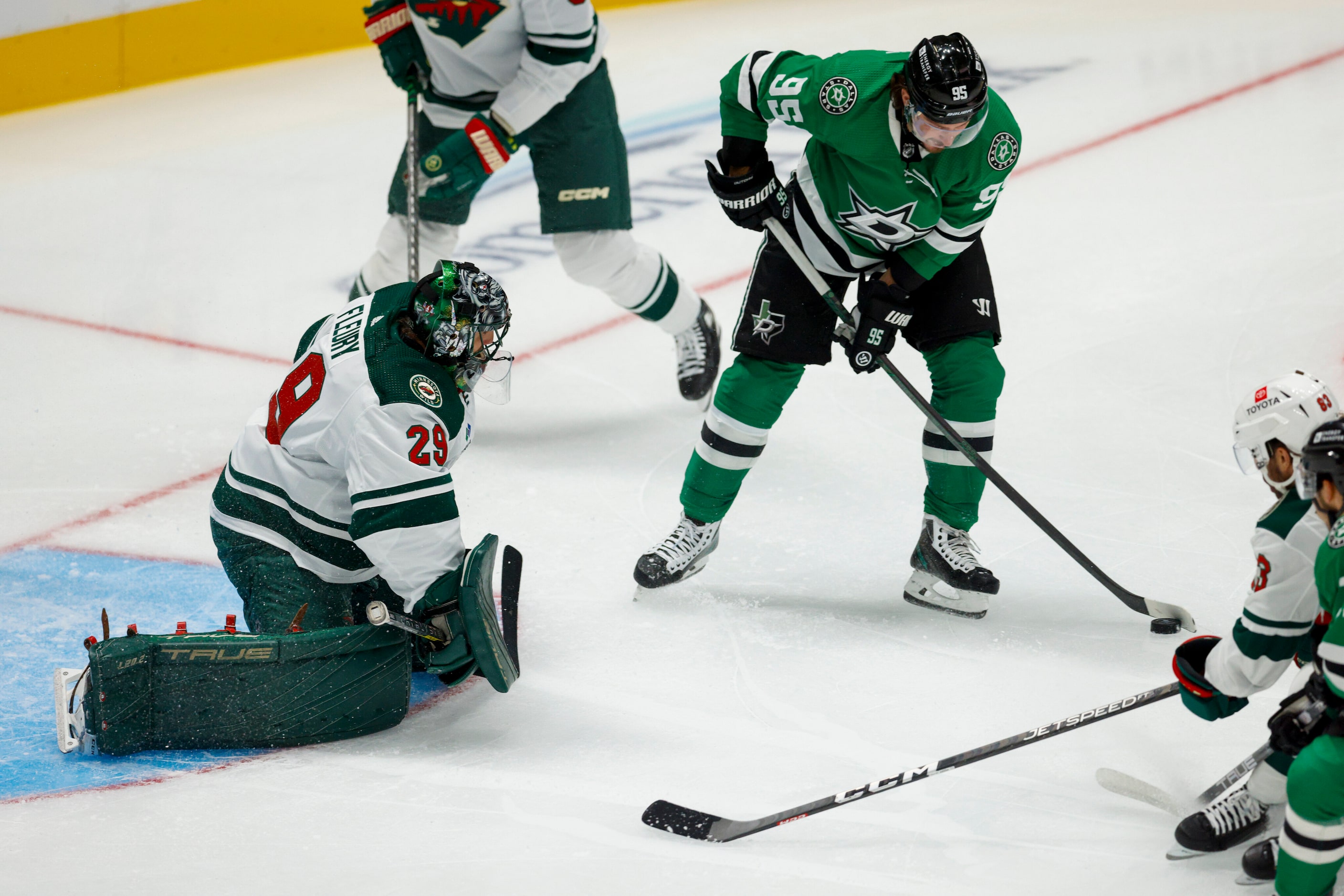 Dallas Stars center Matt Duchene (95) shoots the puck ahead of Minnesota Wild goaltender...